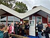 Jens Frederiksen (th. ved siden af statsministeren) nåede som formand for Nysted Sauna- og Havbad at få forklaret hele tre ministre om udfordringerne med at få tilladelse til en tilbygning til den toppopulære sauna. Foto: Kim Møller Pedersen